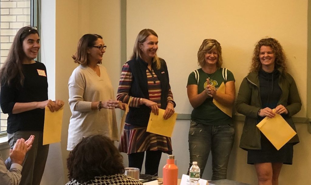 Intermediate (3-5/6) Literacy Collaborative coach, Samantha Dormady (R) receiving her certificate of completion with fellow Literacy Collaborative coaches.