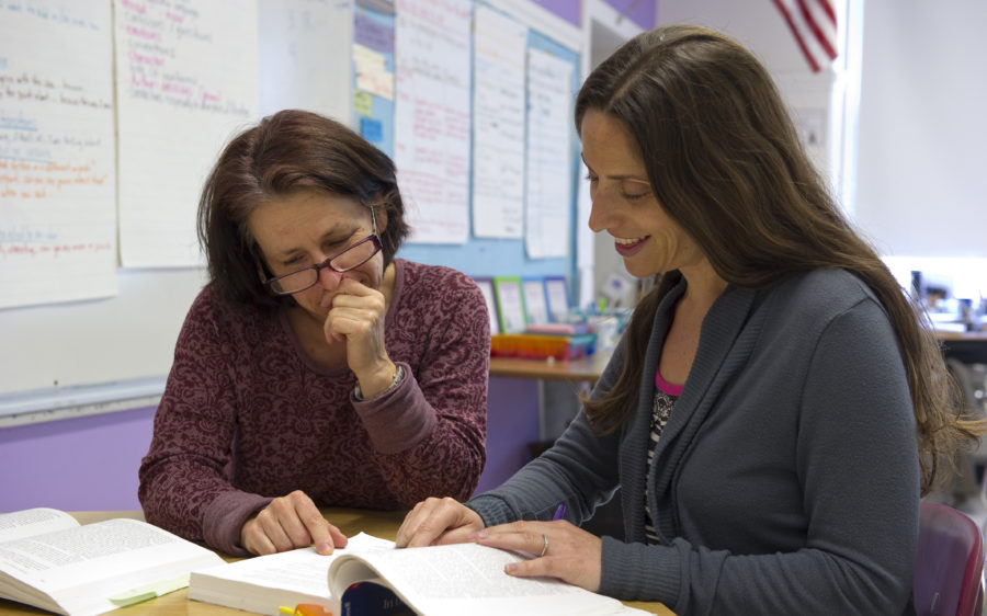 Two adults studying