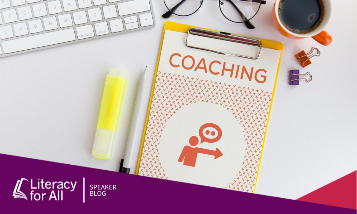 Image of a desk with a booklet that says "coaching" on the cover.