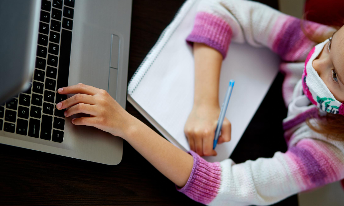 Girl Studying at Home on a Laptop