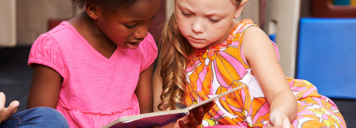 Young students reading a picture book.