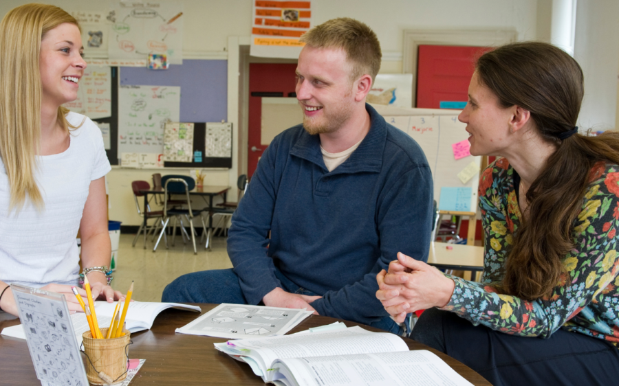 Three teachers talking.